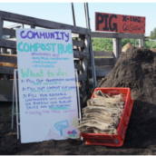 sign and compost pile